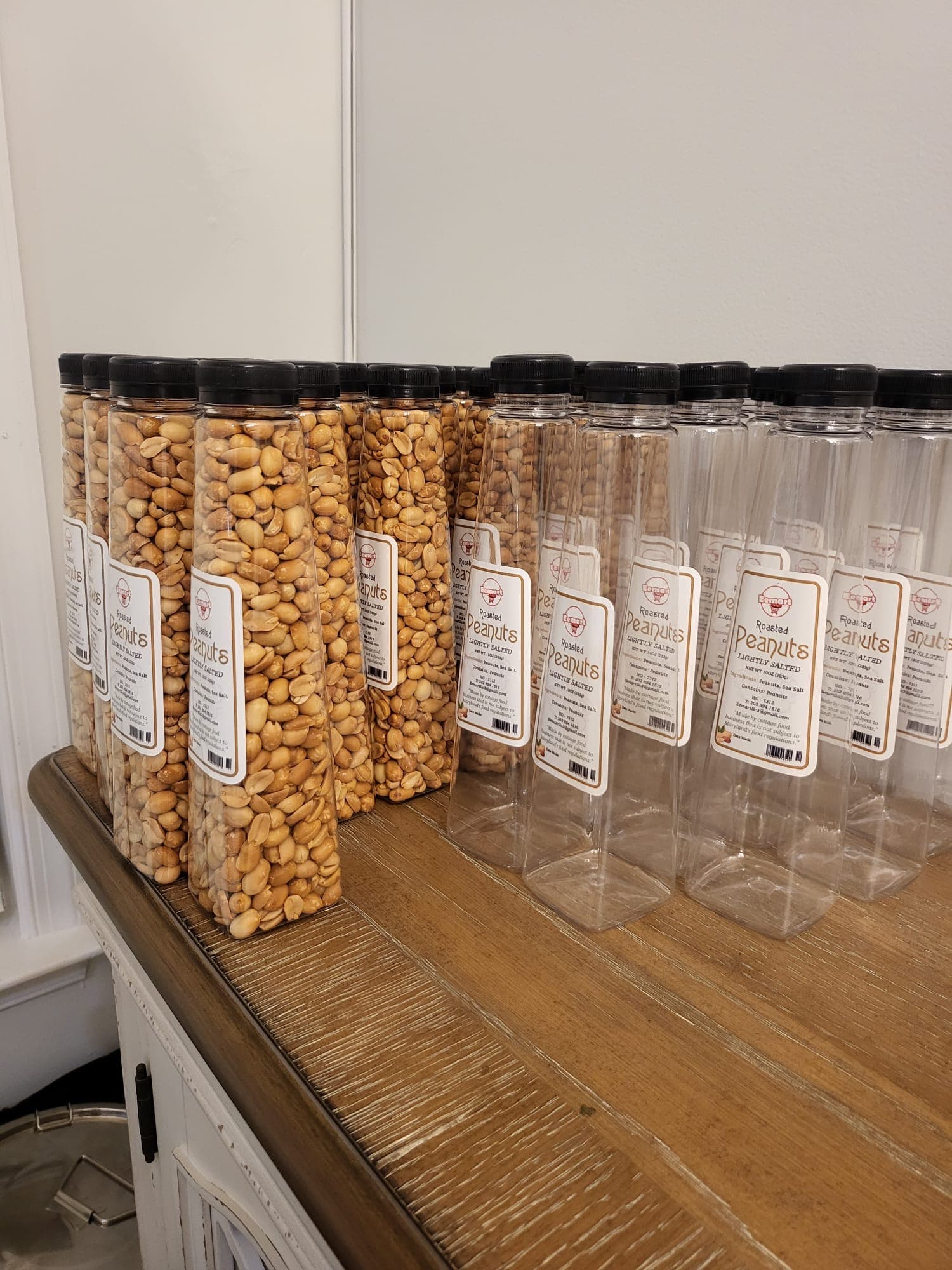 EEMART roasted peanut bottles being prepared and filled